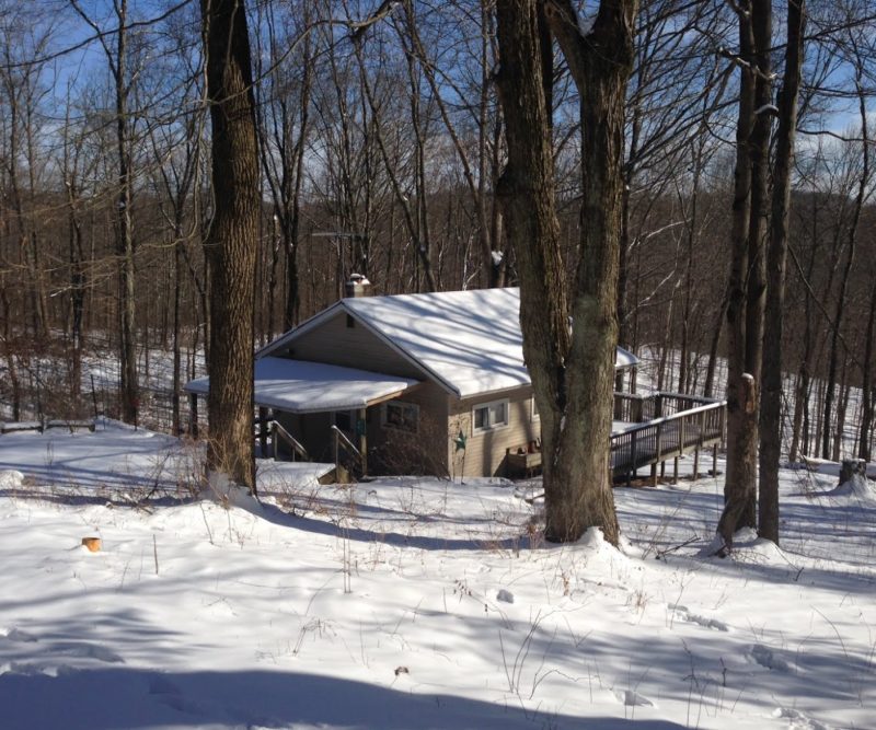 Picture of the Ravine Trail Cabin covered in snow